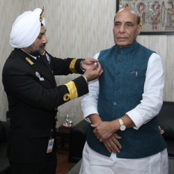 Secretary, Kendriya Sainik Board Commodore HP Singh pinning the Armed Forces Flag on Hon'ble Raksha Mantri Shri Rajnath Singh in New Delhi on December 06, 2022 ahead of Armed Forces Flag Day.