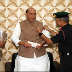 Secy ESW and JS (ESW) with officials of KSB pinning AFFD flag to Hon'ble RM on 07 Dec 19.